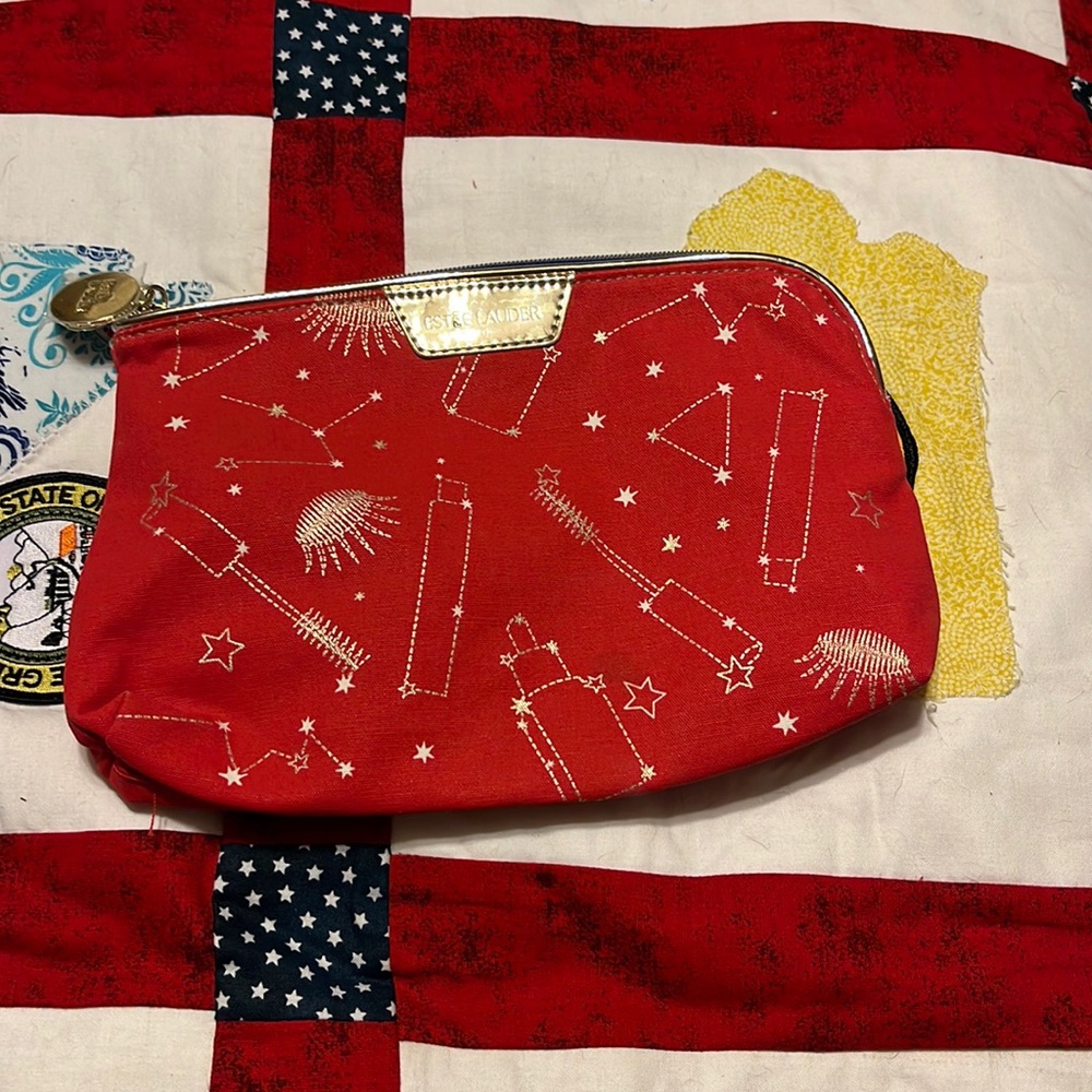 Estee Lauter make up bag of red with mascara designs. Super cute.